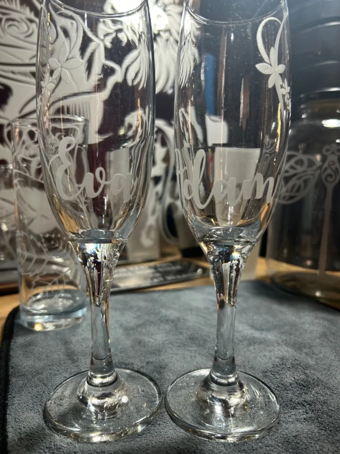 **Sandblasted Sparkling Wine Glasses for Special Occasions**

Sparkling wine glasses are one of our most popular sandblasted items, often chosen for weddings, anniversaries, matric balls and birthdays. Their curved shape can make custom decoration challenging, especially with newer methods that are difficult to apply evenly to curved surfaces.

Sandblasting lets us work carefully with the shape of each glass to create a distinctive, tactile finish for your celebration. Contact us to discuss your design and order.