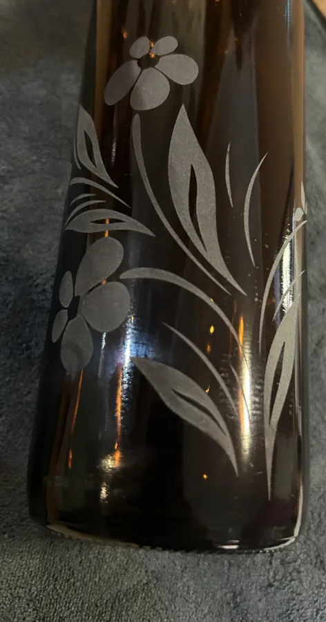 On Coloured Glass the effect of the sandblasting can observed much easier as the frosted areas leave a whitish back ground